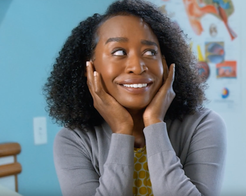 Woman with hands on her cheeks