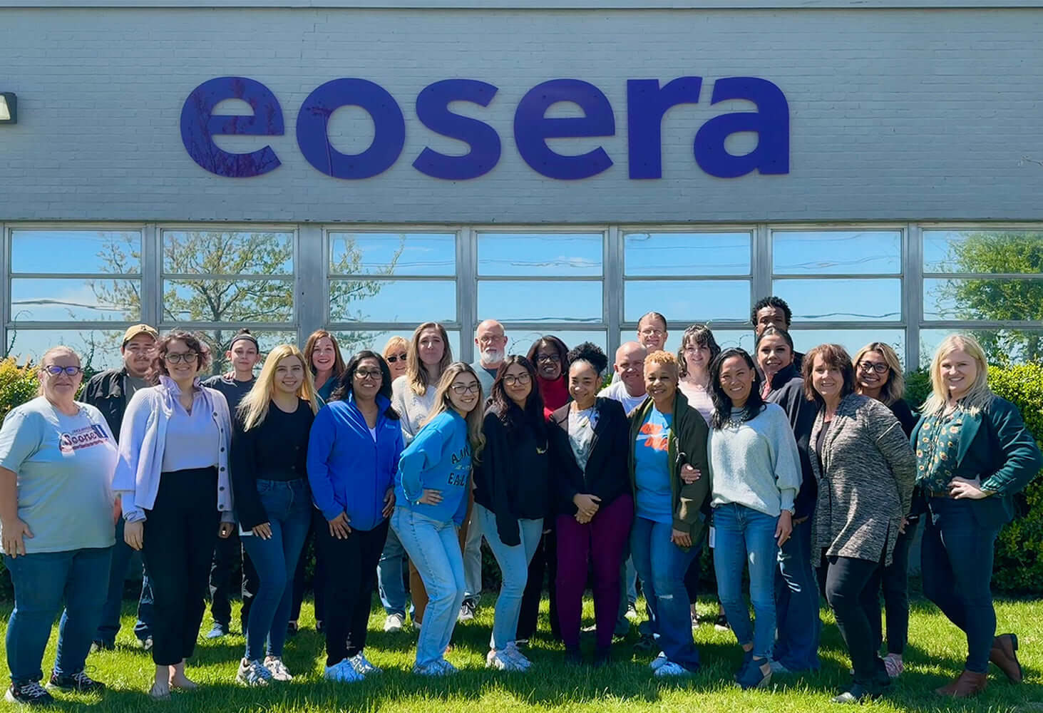 Group photo of the eosera team standing outside their headquarters, showcasing unity and collaboration.